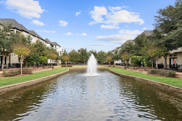 surrounding community featuring a water view