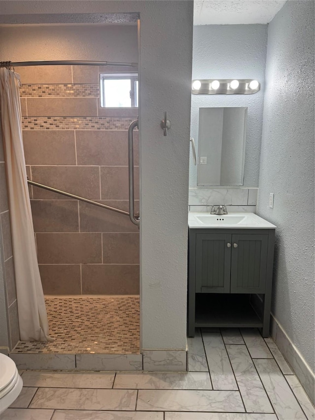 512 Threlkeld St, Houston, TX 77007 - bathroom featuring vanity, marble finish floor, toilet, and a shower stall