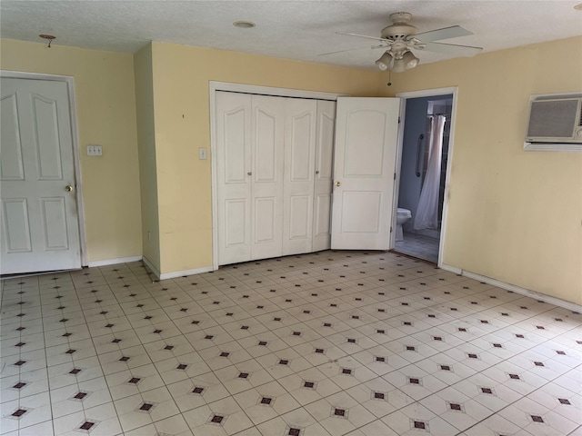 512 Threlkeld St, Houston, TX 77007 - interior space with ceiling fan, a wall mounted AC, baseboards, a closet, and ensuite bathroom