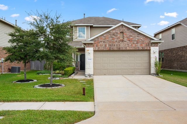 view of property with a front yard, central AC, and a garage