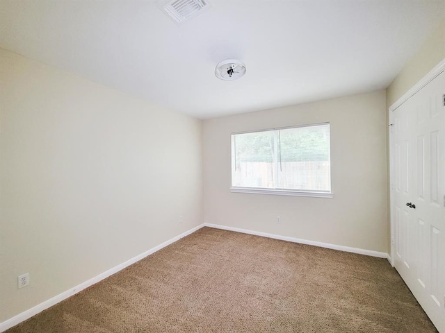 view of carpeted spare room