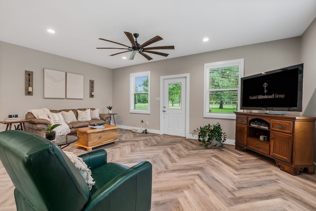 living room with ceiling fan and light parquet floors