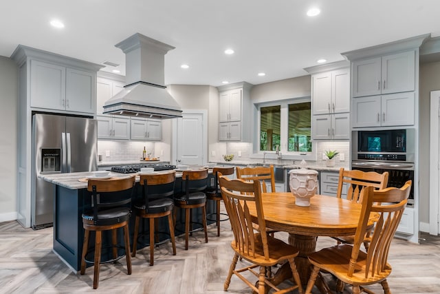 dining space featuring light parquet floors