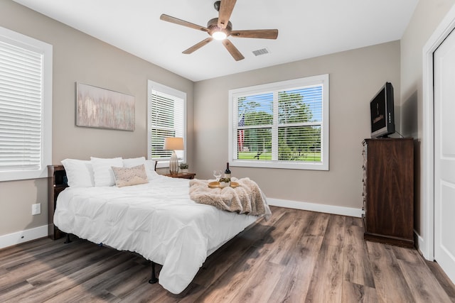 bedroom featuring hardwood / wood-style flooring and ceiling fan