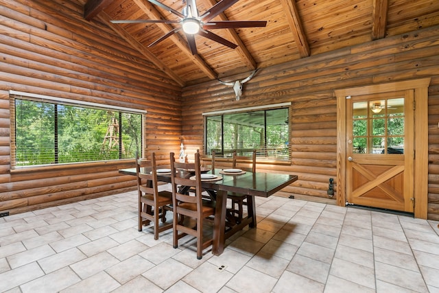 tiled dining space featuring beam ceiling, ceiling fan, log walls, high vaulted ceiling, and wood ceiling