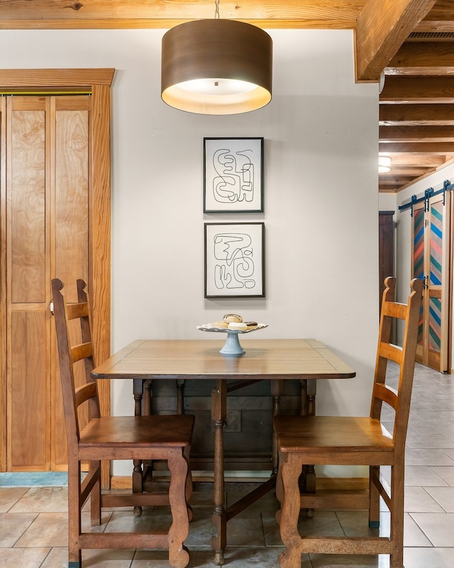 dining space with a barn door