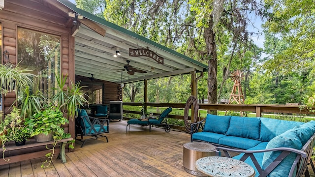 deck featuring an outdoor hangout area and ceiling fan