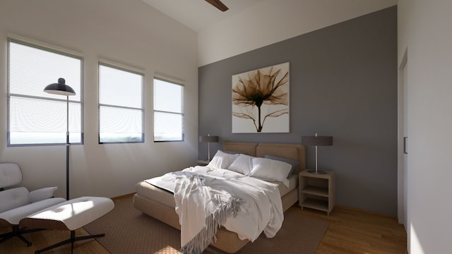 bedroom with ceiling fan and wood-type flooring