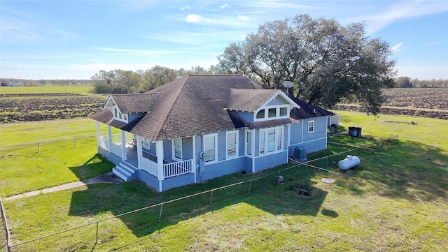 birds eye view of property with a rural view