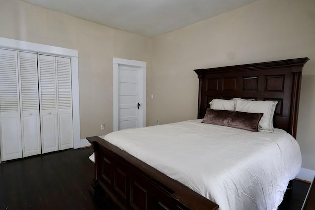 bedroom featuring a closet and dark hardwood / wood-style floors