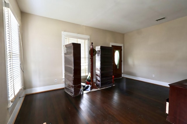 unfurnished bedroom with hardwood / wood-style flooring