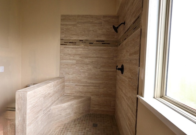 bathroom with tiled shower