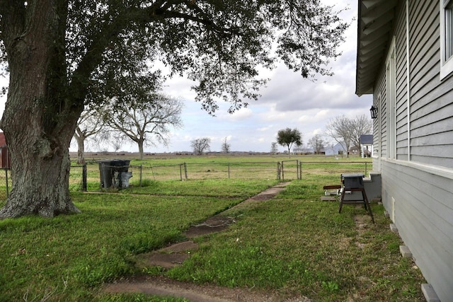 view of yard with a rural view