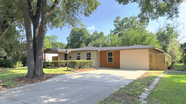 single story home with a front yard