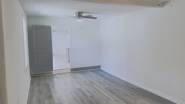 unfurnished room with light wood-type flooring and ceiling fan