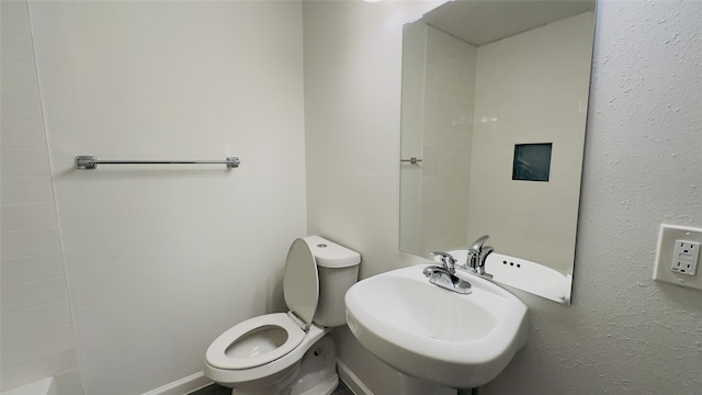 bathroom with toilet and sink