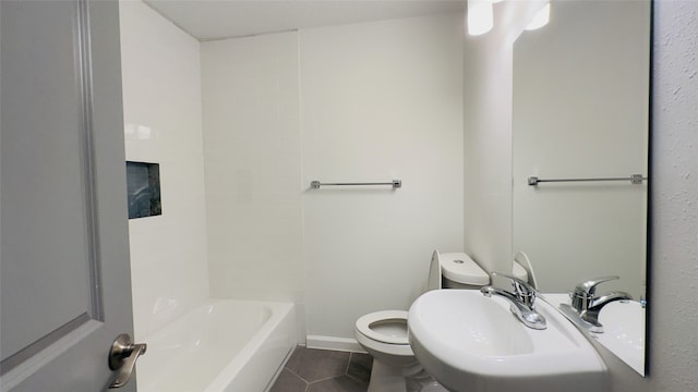 full bathroom featuring toilet,  shower combination, tile patterned floors, and sink