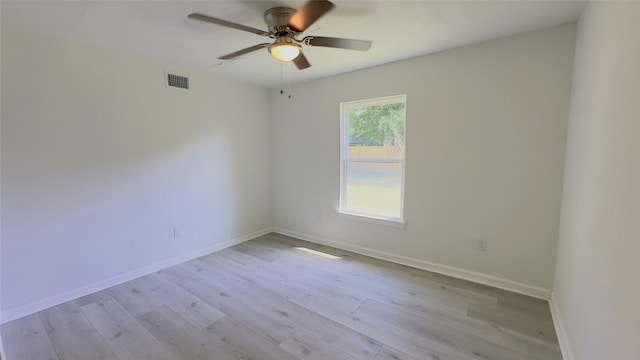 unfurnished room with light wood-type flooring and ceiling fan