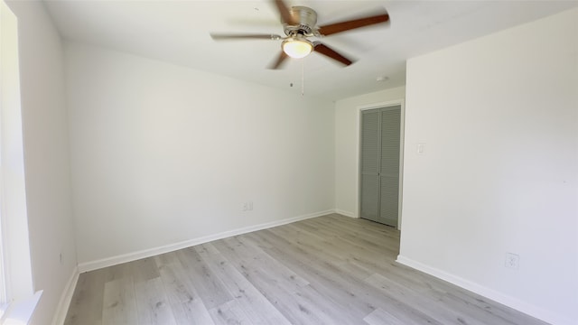 empty room featuring ceiling fan and light wood-type flooring