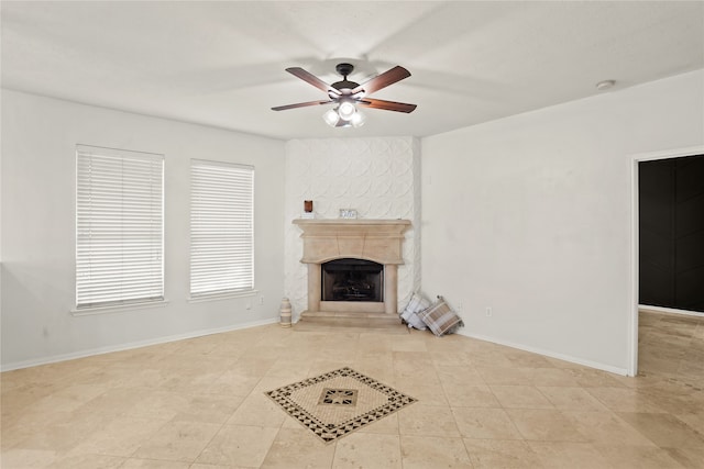 unfurnished living room featuring ceiling fan and light tile patterned floors