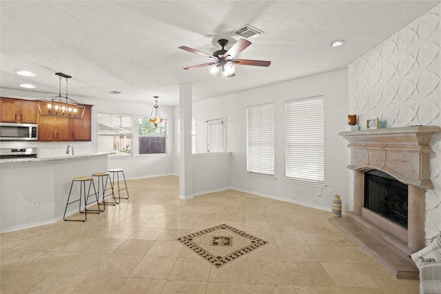 living room featuring ceiling fan and light tile patterned flooring