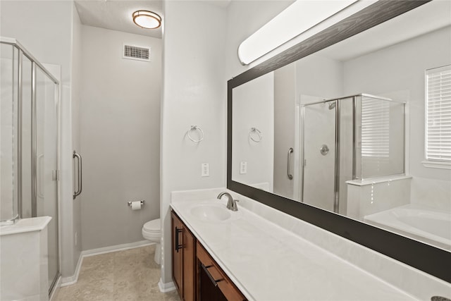 bathroom featuring vanity, toilet, and a shower with shower door