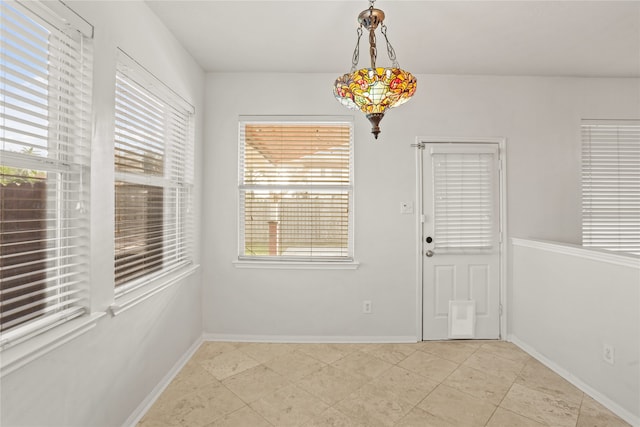 unfurnished dining area featuring a wealth of natural light