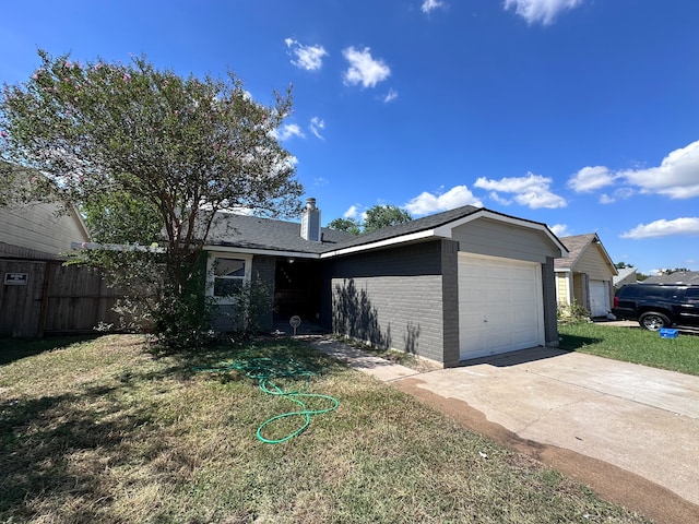 ranch-style house featuring a front lawn and a garage