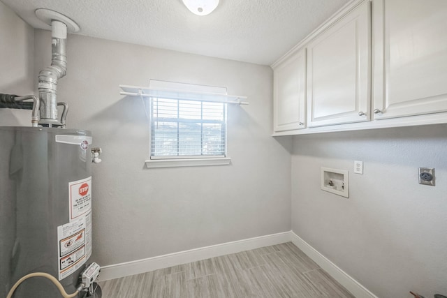 laundry room with cabinets, hookup for an electric dryer, gas water heater, and a textured ceiling