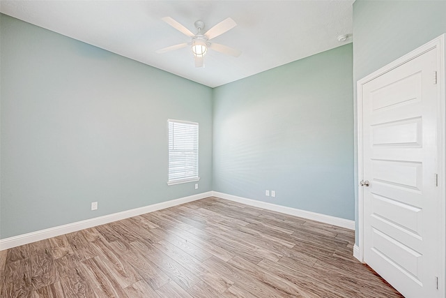 empty room featuring ceiling fan and light hardwood / wood-style flooring