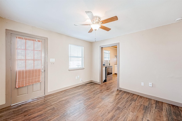 unfurnished room featuring ceiling fan and hardwood / wood-style floors