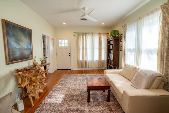 interior space with hardwood / wood-style flooring, ceiling fan, and a healthy amount of sunlight