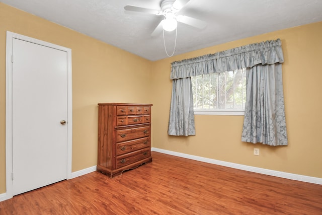 bedroom with ceiling fan and hardwood / wood-style floors