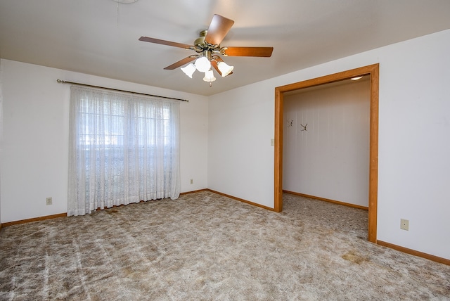 unfurnished bedroom featuring ceiling fan and light carpet