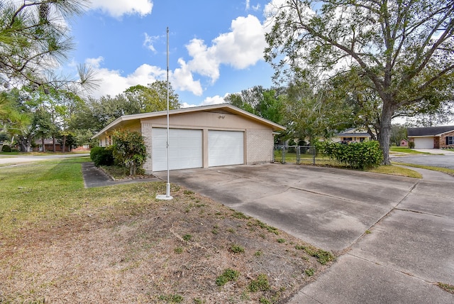 view of property exterior with a yard and a garage