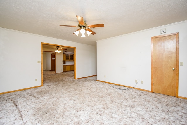 spare room featuring carpet flooring and a textured ceiling