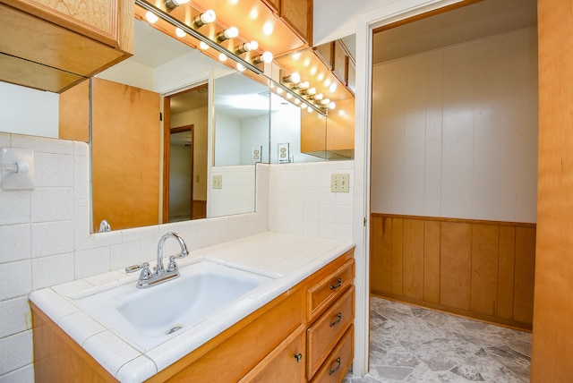 bathroom with vanity and backsplash