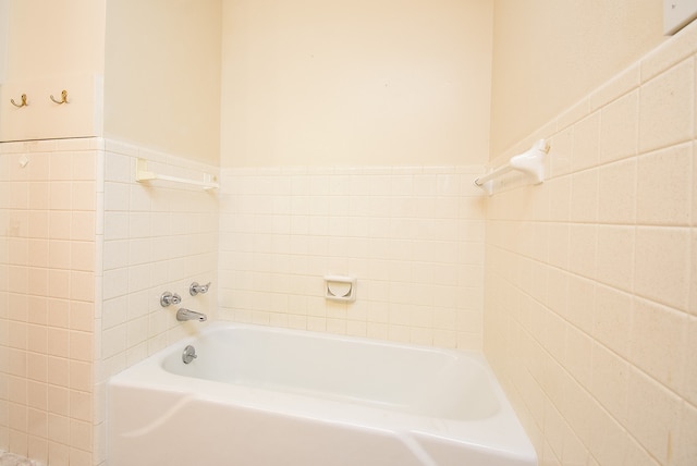 bathroom featuring a tub to relax in