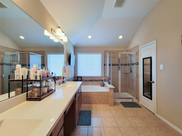 bathroom with tile patterned floors, vanity, lofted ceiling, and shower with separate bathtub