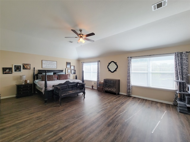 bedroom with ceiling fan, dark hardwood / wood-style floors, and vaulted ceiling