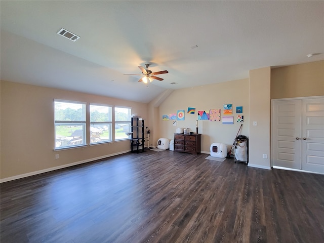 unfurnished living room featuring dark hardwood / wood-style floors, ceiling fan, and lofted ceiling