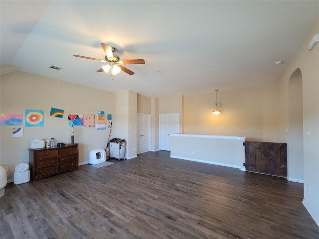 interior space featuring ceiling fan and dark wood-type flooring