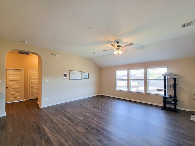 unfurnished living room featuring dark hardwood / wood-style floors, ceiling fan, and lofted ceiling