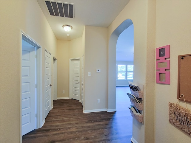 hall with dark hardwood / wood-style floors