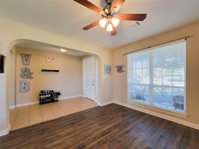 foyer with wood-type flooring and ceiling fan