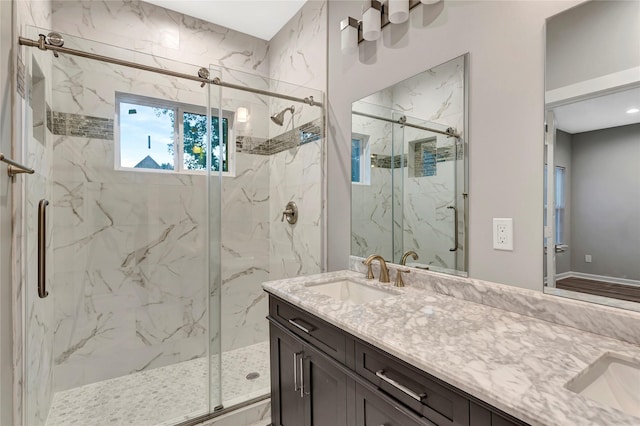 bathroom featuring vanity and an enclosed shower