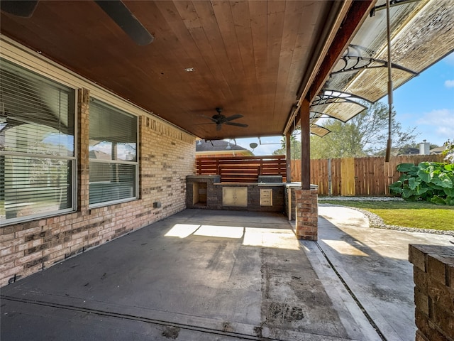 view of patio / terrace with area for grilling and ceiling fan