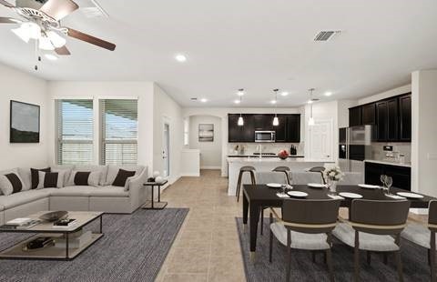 tiled dining room featuring ceiling fan