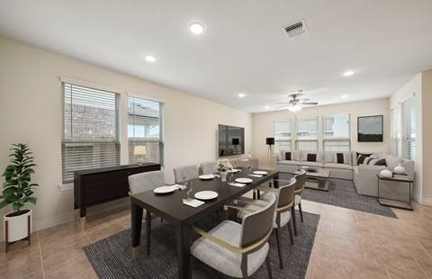 dining space featuring tile patterned flooring and ceiling fan