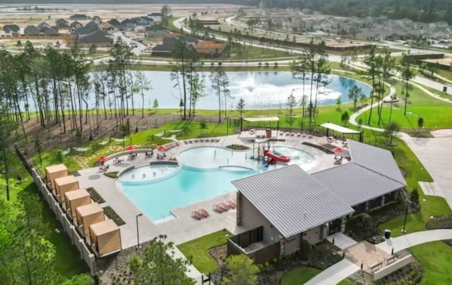 view of pool featuring a water view